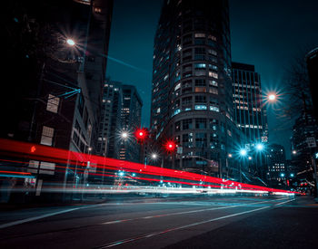 Illuminated long exposure city street at night