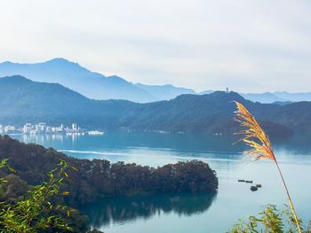 Scenic view of lake with mountains in background