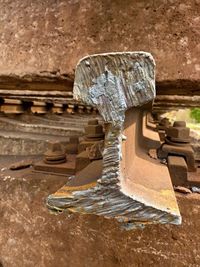 Close-up of rusty metal on table