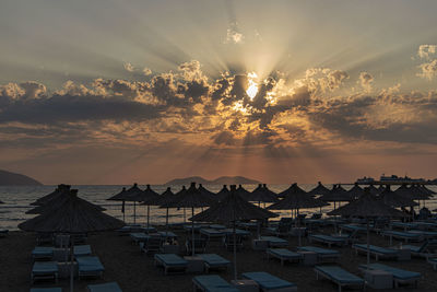 Scenic view of beach against sky during sunset