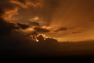 Scenic view of dramatic sky during sunset