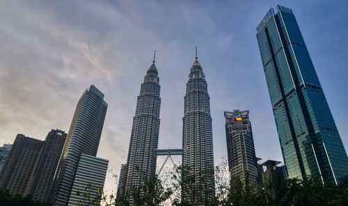 Low angle view of modern buildings against sky petronas towers 
