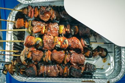 High angle view of meat on barbecue grill