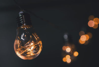 Close-up of illuminated light bulb