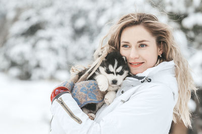 Woman with dog during winter