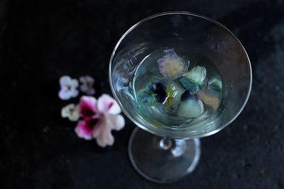 High angle view of drink with flowers on table