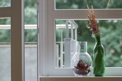 Close-up of vase on window sill