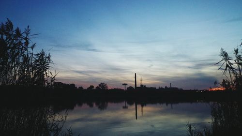 Scenic view of lake at sunset