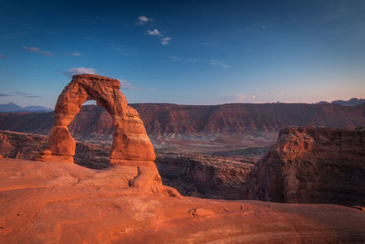 Rock formations on landscape against sky