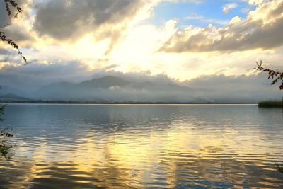 Scenic view of lake against sky during sunset