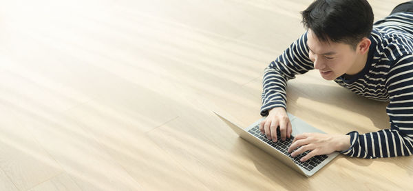 High angle view of boy using mobile phone