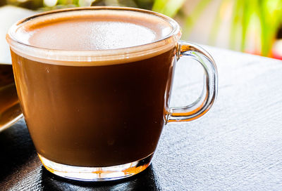 Close-up of coffee cup on table