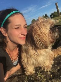 Portrait of smiling woman with dog