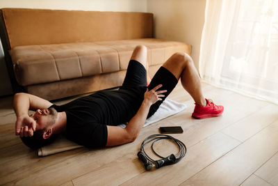 High angle view of man exercising at home