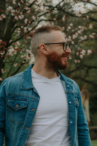 Portrait of young man standing outdoors