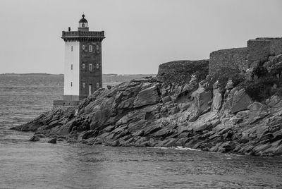 Lighthouse facing molene island lighthouse guidance tower water coast monochrome photography