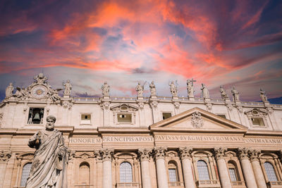 Low angle view of building against cloudy sky