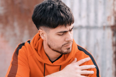 Close-up portrait of man posing with sportswear