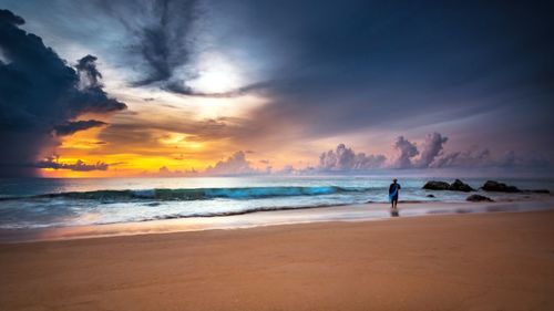 Scenic view of sea against cloudy sky