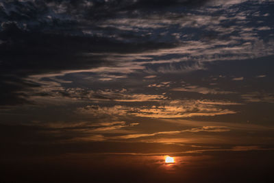 Low angle view of dramatic sky during sunset