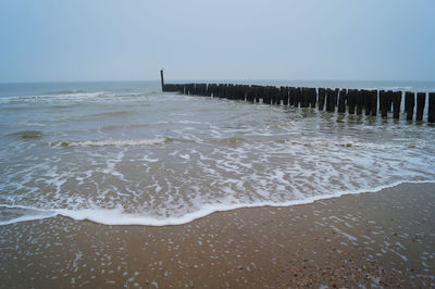 Scenic view of beach against clear sky