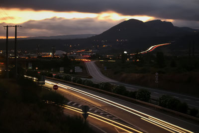 High angle view of light trails on road at night