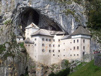 Low angle view of buildings on cliff