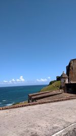 Scenic view of sea against clear blue sky