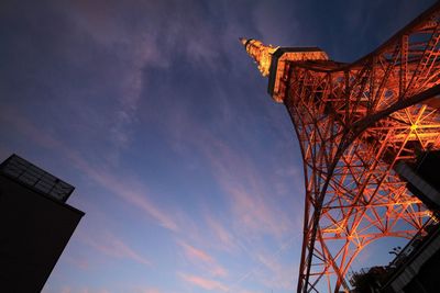 Low angle view of illuminated tokyo tower against sky