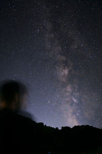 Low angle view of silhouette stars against sky at night