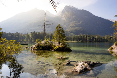 Scenic view of lake and mountains against sky