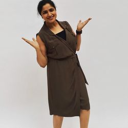 Young woman standing against white background