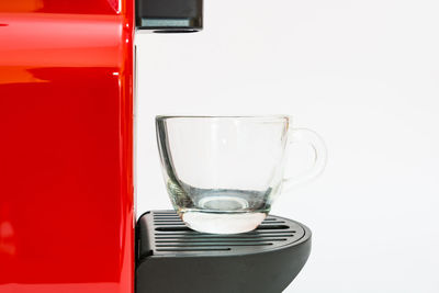 Close-up of wineglass against white background