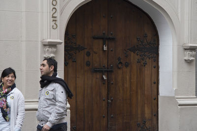 People standing by door