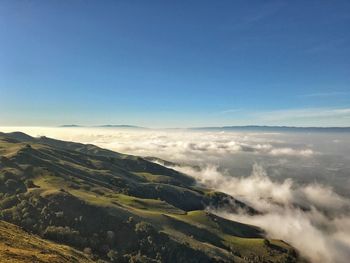 Scenic view of mountains against clear blue sky