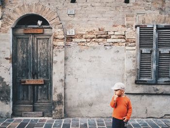 Old man standing in building