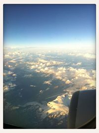 Aerial view of landscape against blue sky