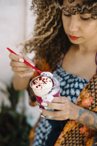 Woman eating ice cream outdoors