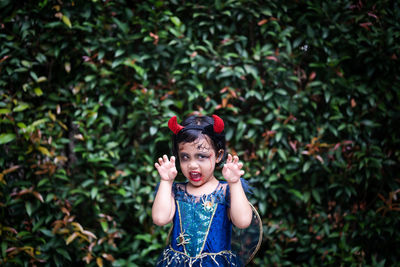 Portrait of cute girl in halloween costume.