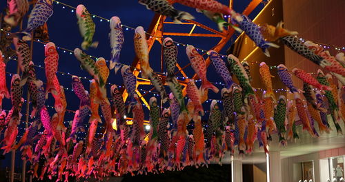 Low angle view of decoration hanging for sale at market stall