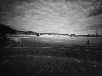 Man on field against sky