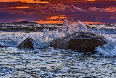 Scenic view of sea against sky during sunset