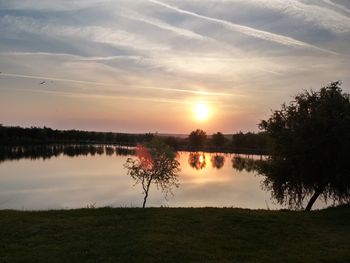 Scenic view of lake against sky during sunset