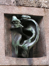 Close-up of statue against wall