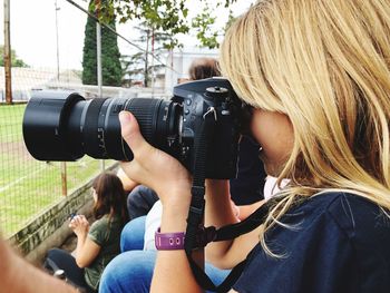 Midsection of woman photographing