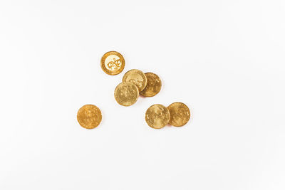 Close-up of coins on white background