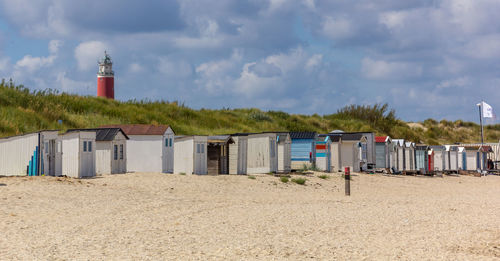 Built structure on beach against sky