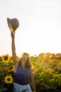 Young woman in sunflower farm