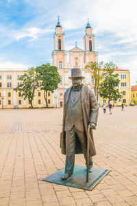 Low angle view of statue against sky in city