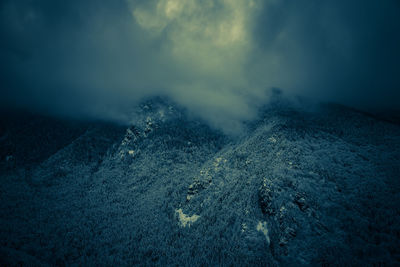 Scenic view of snow capped mountains against sky